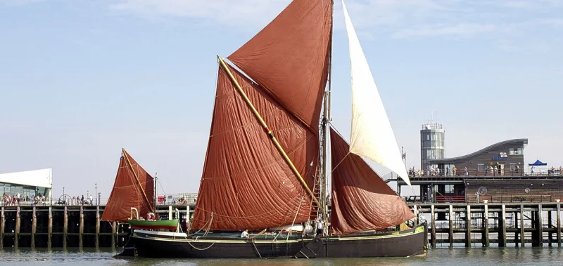 Red Sails Over The Estuary