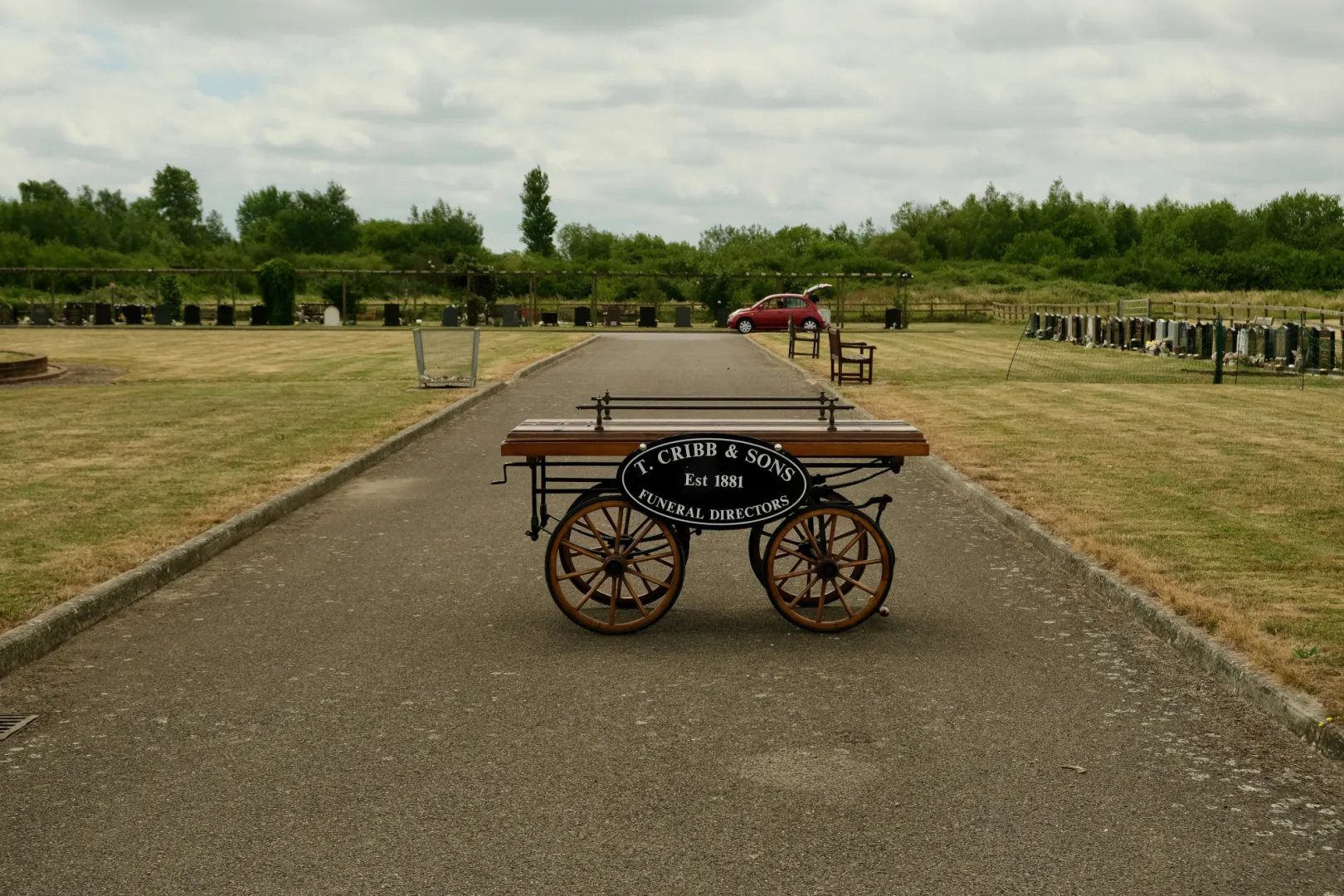A phtograph of an old cart at a memorial ground